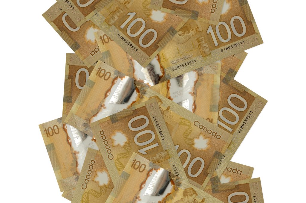 100 Canadian dollars bills flying down isolated on white. Many banknotes falling with white copyspa